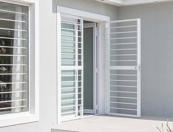 Magnador white single swing barrier with vertical tube bars and arched top rail