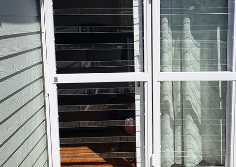 Magnador clearview swing gate on window with curtains