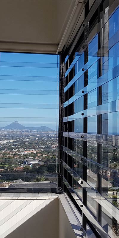 Clear security barrier on corner window with city view
