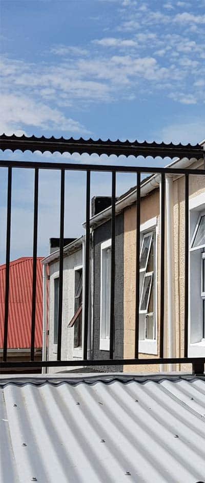 Anti-climb deterrent spikes along boundary top edge